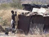 17 July 2010: A woman in Killarney informal settlement demolishes her shelter - evicted and on the move again, exactly 5 years after OM