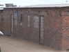 There are 18 government-funded, “Operation Garikai” houses in Hopley farm, Harare, where 3,800 displaced live: windows and doors have been bricked up because there are no door or window frames, and also no sewerage, water or electricity, five years after being built. [July 2010]